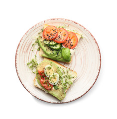 Plate with tasty sandwiches on white background