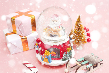 Christmas composition, gifts on pastel pink background, copy space
