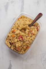 fresh vegetable salad with couscous in plastic box