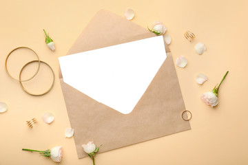 Composition with blank card and envelope on color background