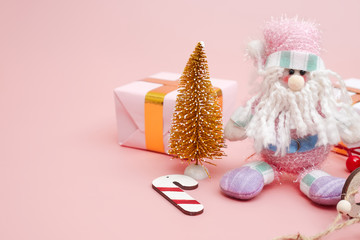 Christmas composition, gifts on pastel pink background, copy space