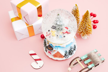 Christmas composition, gifts on pastel pink background, copy space