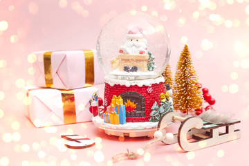 Christmas composition, gifts on pastel pink background, copy space