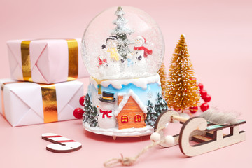 Christmas composition, gifts on pastel pink background, copy space