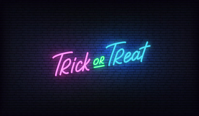 Trick or Treat lettering neon sign. Halloween holiday vector design