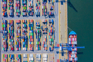 Aerial top view container cargo ship waiting for loading, import export business logistic and transportation by ship in open sea.