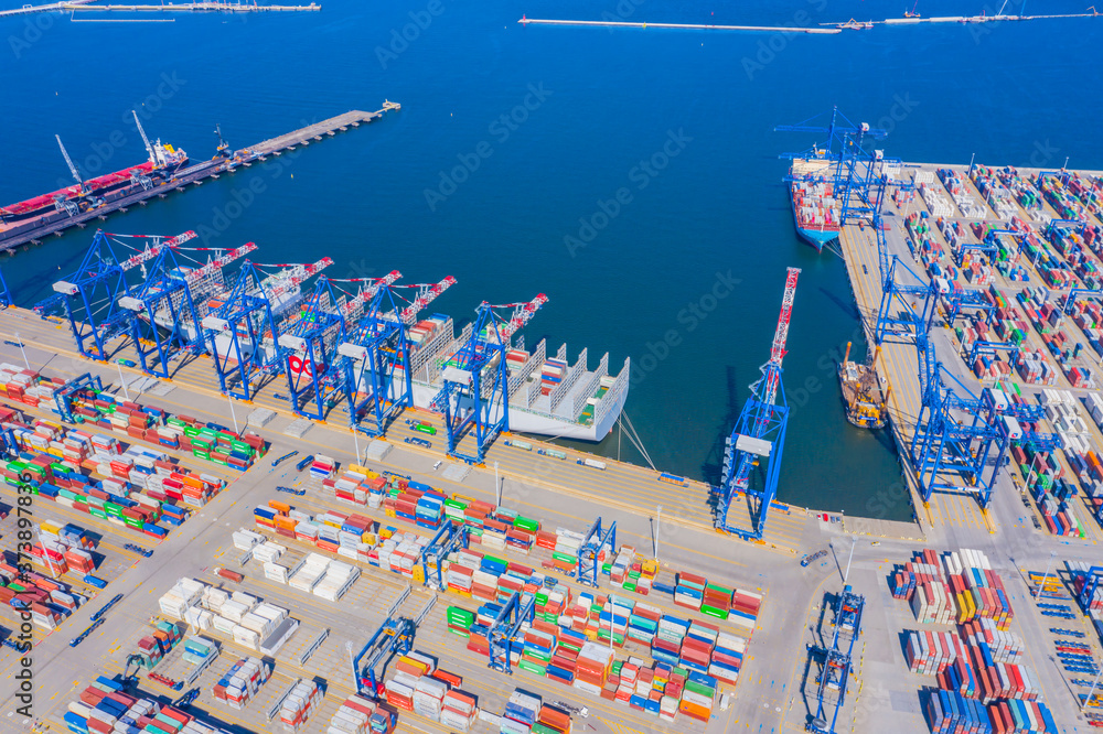Poster aerial top view container cargo ship waiting for loading, import export business logistic and transp