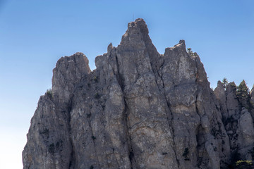 Yalta, Crimean Peninsula. Russia. Curly teeth of Ai-Petri at an altitude of 1200 meters above sea level. Blue sky background