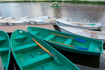 Russia, Yoshkar-Ola, July 24, 2020, view of the Kremlin pier with boats and the Kokshaga river, reflection in the water.