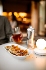Man drinking beer with gedza dumplings