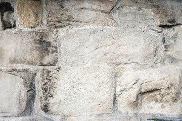 Abstract background. Fragment of old wall from chipped stone