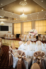 Tender pink flower bouquet on the banquet table