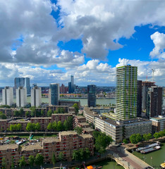 Naklejka premium A beautiful and dramatic panoramic shoot of the Rotterdam city skyline with a spectacular dramatic clouds