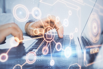 Social network theme hologram with businessman working on computer on background. Concept of world wide web. Double exposure.