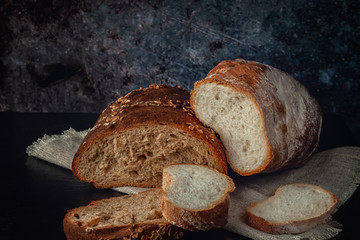 Fresh bread with bran, seeds and oatmeal on the table