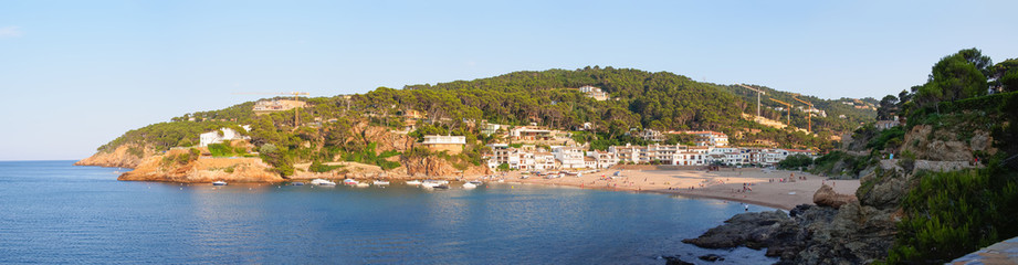 Fototapeta premium Panorama of Sa Riera fishing village near Palafrugell and Begur towns. Costa Brava, Catalunya, Spain. Sa Riera beach at sunset.