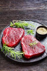 beefsteaks with rosemary and salt, top view