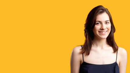 Obraz premium Confidence and success. Personal development. Woman isolated on orange free space. Education advertisement. Professional courses