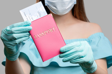 Pandemic protection. COVID-19 prevention. Tourist woman with id and boarding pass. Passport...