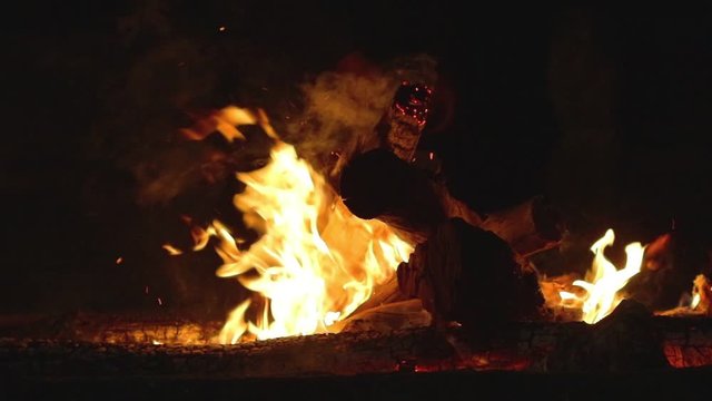 Slow motion of a wooden fire during a night time bon fire