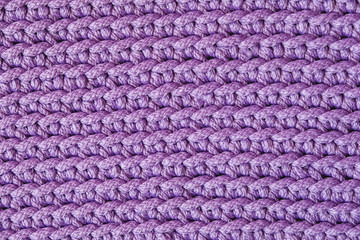 Violet knitted fabric texture background. Top view. Copy, empty space for text