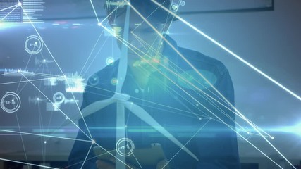 Animation of network connections over wind turbine and caucasian man - Powered by Adobe