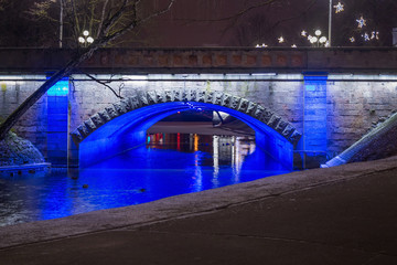 Night winter view of the Alexander bridge in Bastion Hill town park in Riga (Latvia). The bridge...