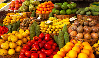 Exotic tropical fruits on the market. Edible bright background. Organic healthy food