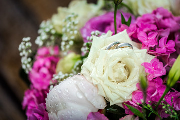 Wedding rings in a wedding bouquet