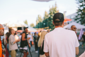 Blur defocused background of people in park fair, summer festival