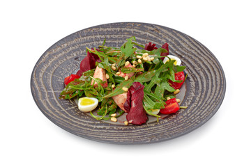 Salad with grilled beef slices and lettuce isolated on white