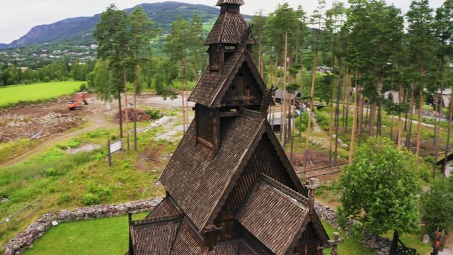 Close Up Details Of The Wooden Roof Of Borgund Stave Church In Laerdal, Norway With Lush Scenery In The Background - elevated drone shot (orbiting)