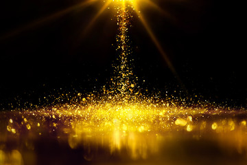 Golden glitter spatter are bokeh lighting texture blurred abstract background for anniversary celebration