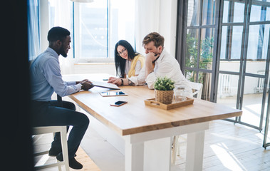 Professional black agent selling apartment to couple