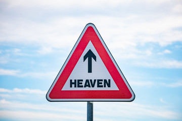 Roadsign with an arrow inside pointing to heaven