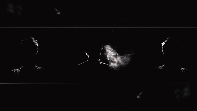 Silhouette of Men Smoking Cigarettes Blowing Smoke. Silhouette of men puffing cigarette smoke on a dark background. Smoke clouds