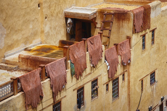 The leathers are dried on the roofs of the old tannery buildings in Fez. Morocco. The tanning industry in the city is considered one of the main tourist attractions.