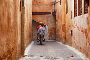 Unknown men on the scooter in Meknes medina. Meknes is one of the four Imperial cities of Morocco...