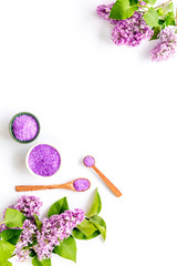 Bath spa set with sea salt and purple flowers. Top view