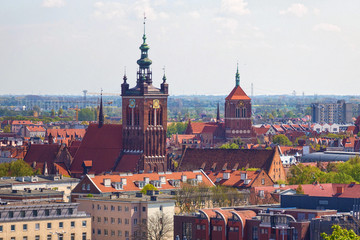 Obraz premium View of the panorama of the old town in the historical part of Gdansk. With view of the St. Catherine's Church (is the oldest church in town). Poland.