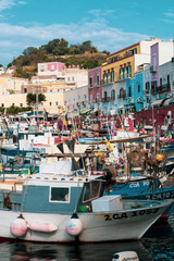 Ponza Island, Italy - 27 July 2019: View of little harbor of Ponza island in the summer season with typical colored houses and boats. Ponza, Italy