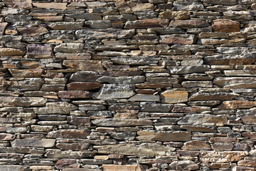 Real antique spanish stone wall background texture