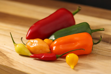 peppers on a wooden board