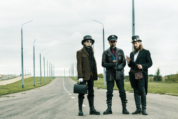 Three mans in steampunk style