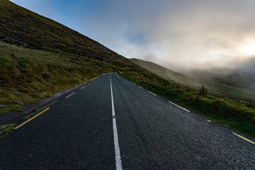 Empty roadway through the Dingle peninsula during misty
