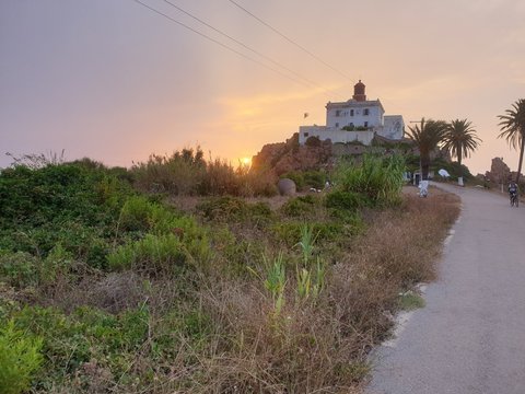 lighthouse in the sunset
