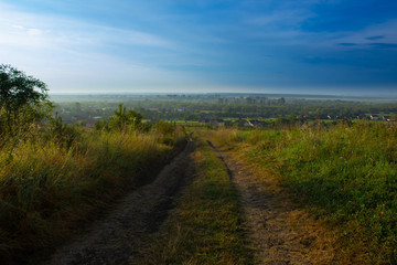 
view from the mountain to the village in the morning at sunrise