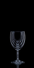 Wine glass on a black background with copy space. Wine collection harmony concept.