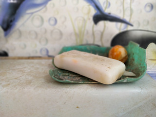 Dirty soap in the basin of the bathroom