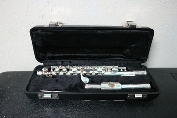 black case with Flute instrument
